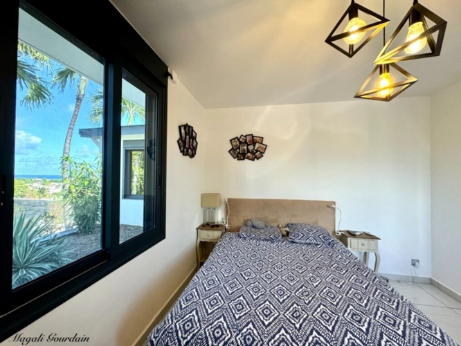 Photos 11 - Prestige - EN EXCLUSIVITE - A VENDRE - PROPRIETE D'EXCEPTION AVEC VUE MER ET POTENTIEL LOCATIF REMARQUABLE - SAINTE ANNE