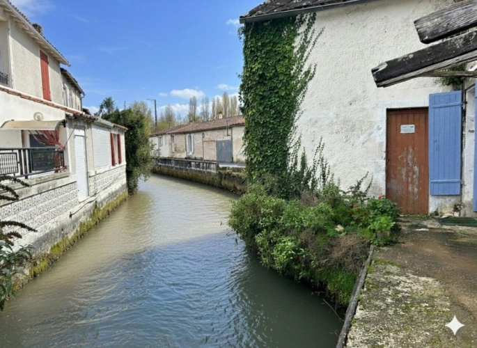 Photos 16 - Rurale - Ancien moulin à eau, une opportunité d'investissement, tout-à-l'égout avec potentiel de construction de plusieurs logements