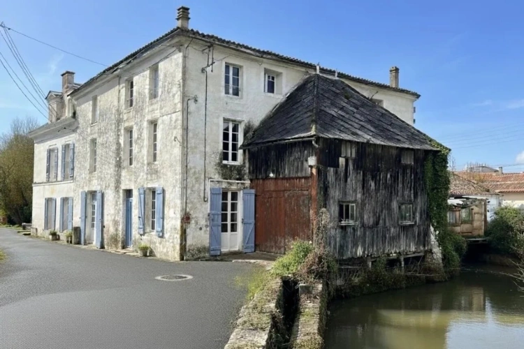 Photos 17 - Rurale - Ancien moulin à eau, une opportunité d'investissement, tout-à-l'égout avec potentiel de construction de plusieurs logements